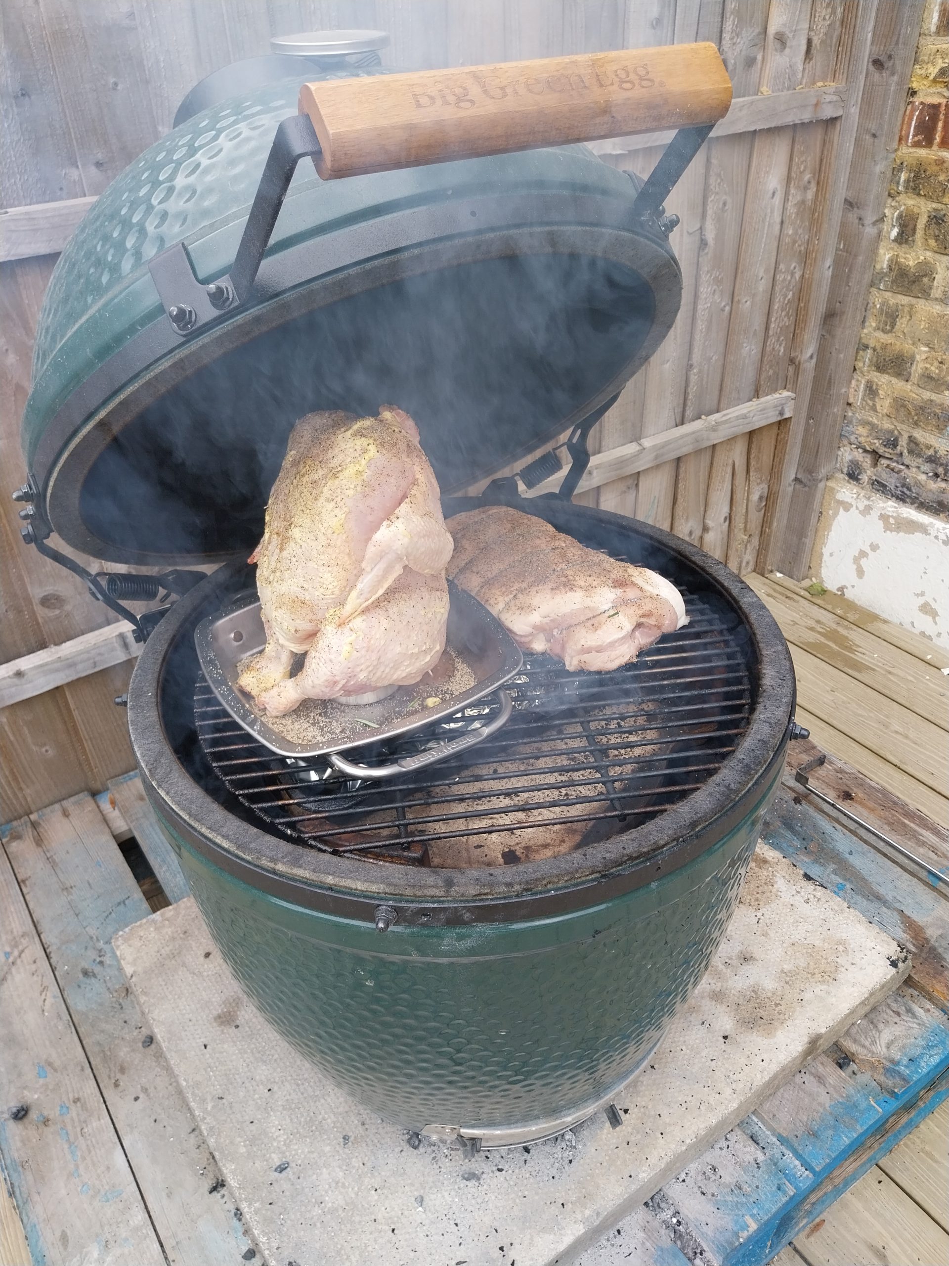 Pork loin and a whole chicken on a Broil King vertical roaster on the BGE Large