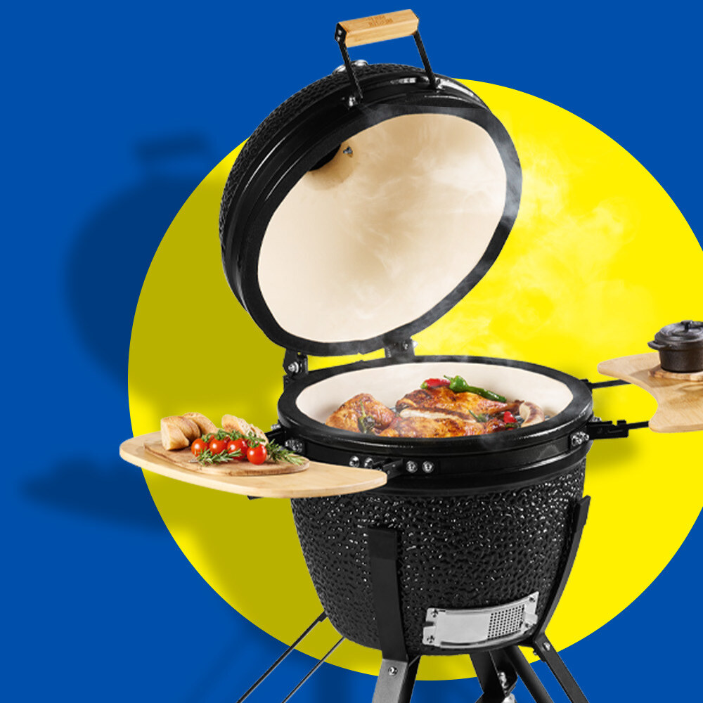 Lidl Medium Ceramic Egg Grill — red-glazed ceramic kamado with bamboo side shelves on a black wheeled cart, May 2026 product imagery