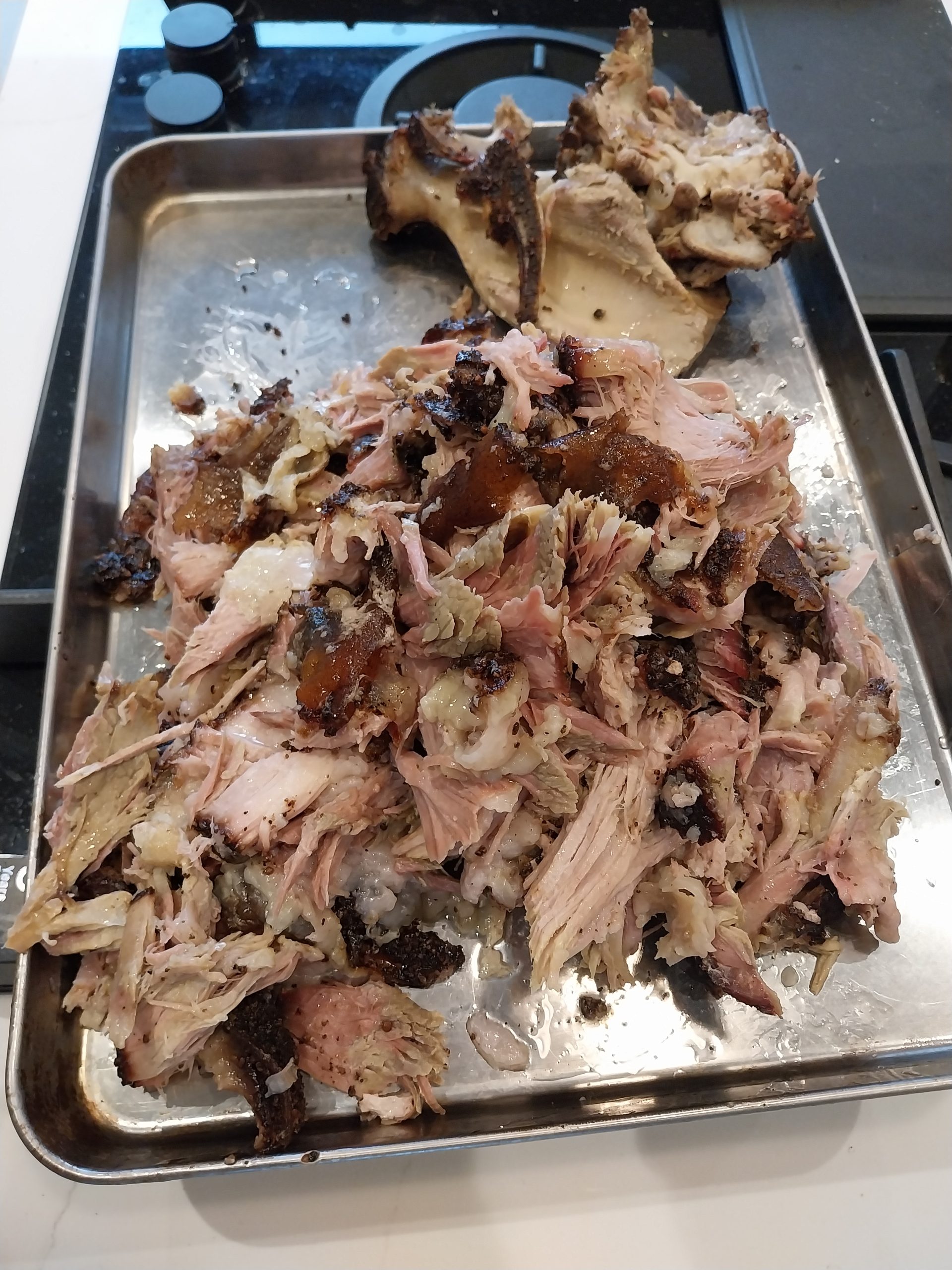 Pulled pork sliders made from a 3.3 kg bone-in shoulder cooked on the BGE Large kamado for twelve and a half hours — the clean-pull result of cook two.