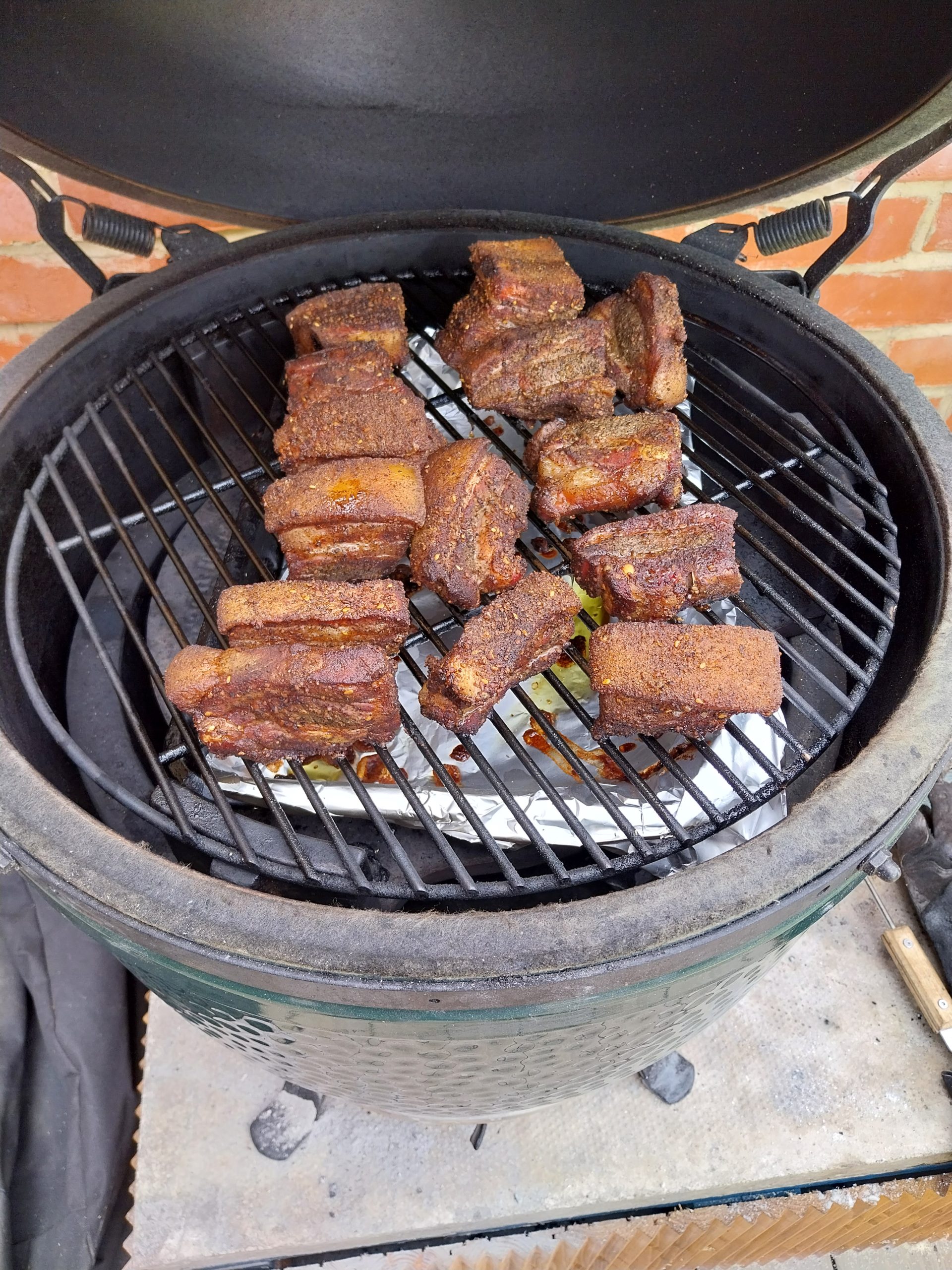 Phase 1 endpoint — cubes reading around 80–85°C internal on a hand-probe, yielding under the prongs, ready to transfer to the cast-iron pan for the chutney glaze.