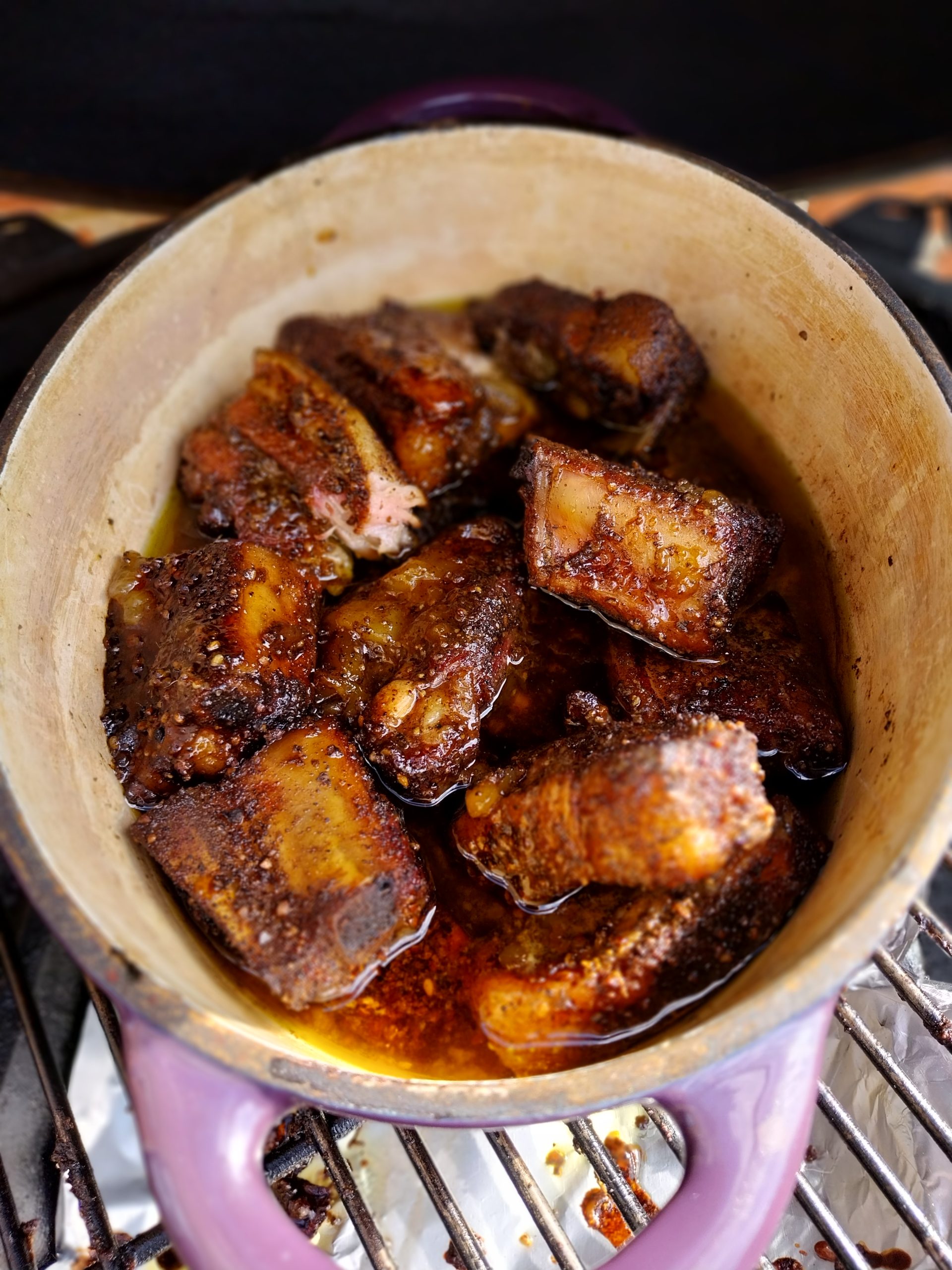 Phase 2 complete — dark sticky mango-chutney glaze reduced onto the cubes, twenty minutes lid-off after three hours lid-on, hand-probed at 96°C internal.