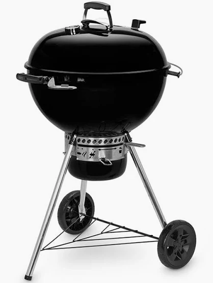 Weber Master-Touch GBS 57cm — three-quarter product view showing the black porcelain-enamel kettle, vented dome lid and Tuck-Away lid-holder on the side of the bowl.