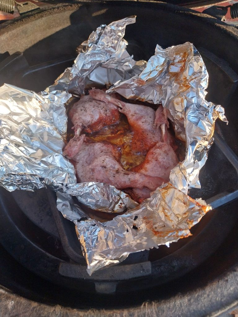 Duck legs cooked through in the foil tray, with the skin that sat above the oil line still soft