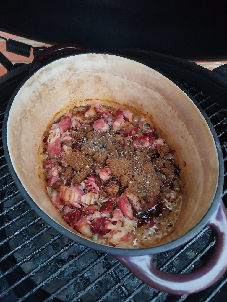 Dark muscovado and black pepper on top of the bacon jam, just added