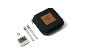 Combustion Predictive Thermometer, Big Green Egg bundle — the branded zip case with two pale probes and the small display unit laid out in front. Image: Big Green Egg UK.