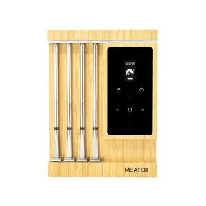 MEATER Pro XL — four stainless probes seated in the bamboo charging block, with the black touch panel alongside. Image: MEATER UK.
