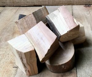A few cut chunks of apple wood on wooden boards. Image: BBQ Land.