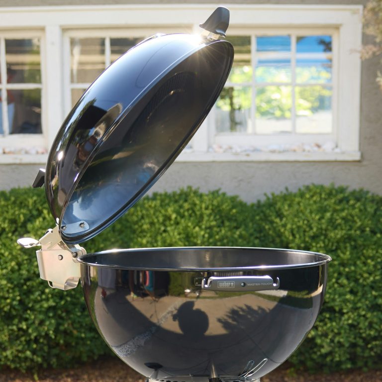 The Weber Master-Touch Premium with its hinged lid swung open