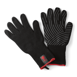 A pair of black Weber Premium Gloves, one showing the grey silicone pattern on the palm, on a dark grey background. Image: Weber.